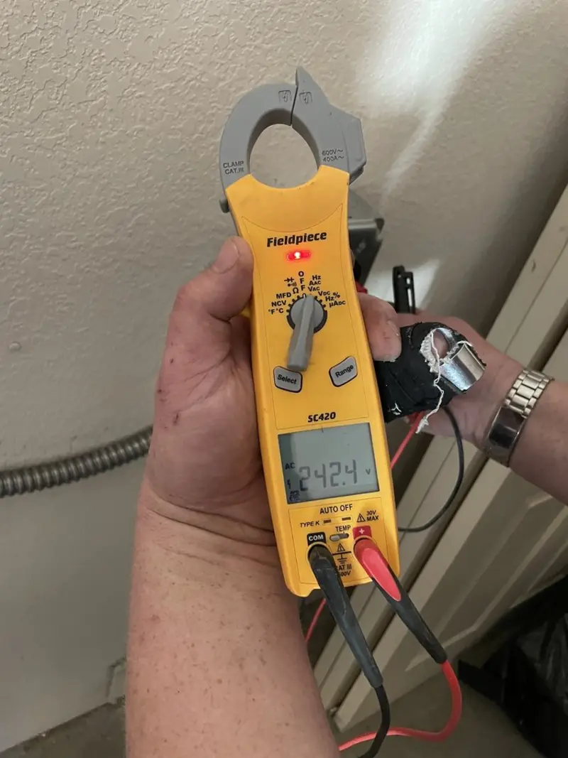 Voltage testing with clamp meter during Electrical Installation Services in Goldsby
